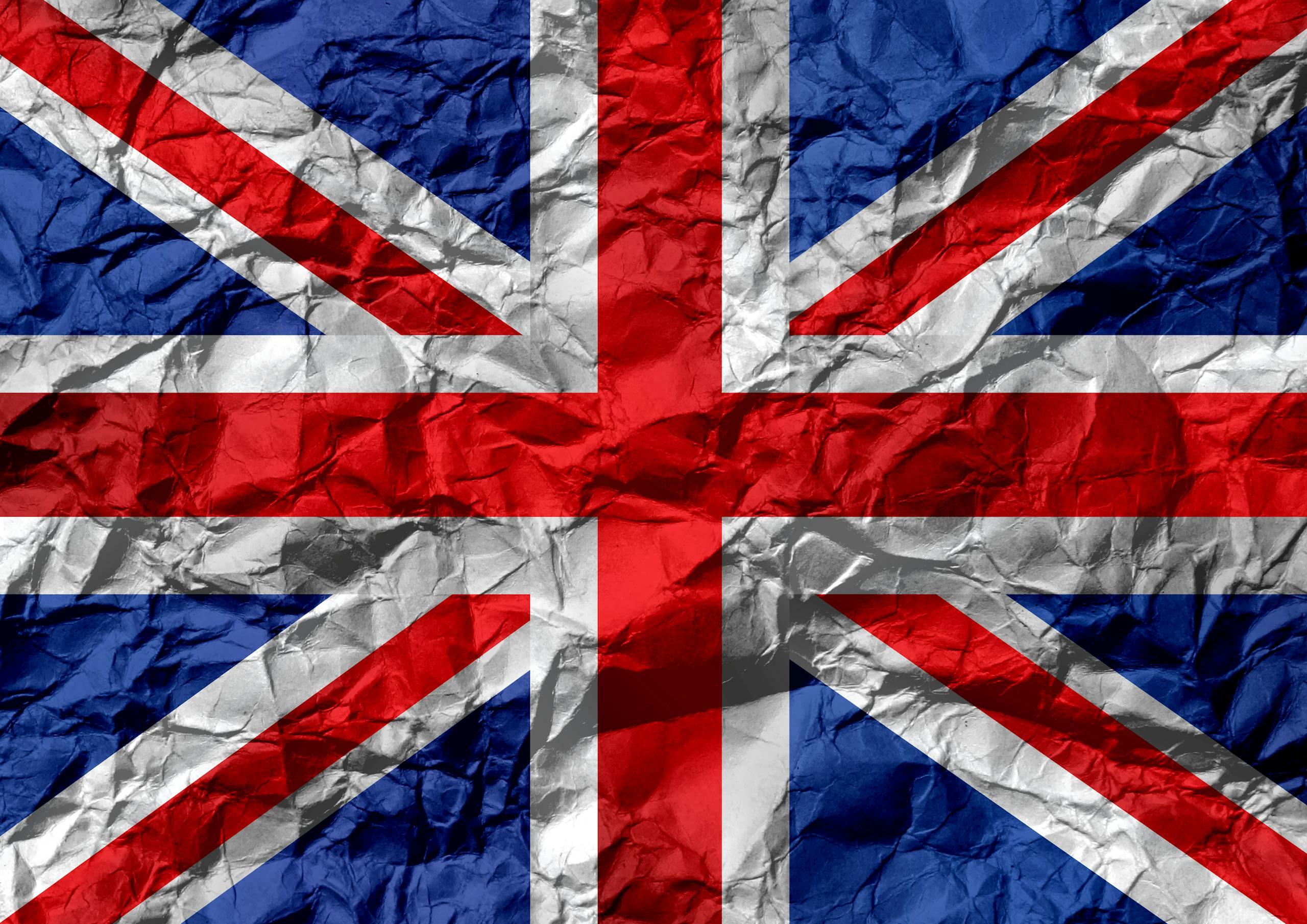 Crumpled texture of the Union Jack flag, symbolizing UK unity and heritage and it's link to the Received pronunciation RP British Accent.